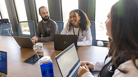 Habitat team members meeting in a conference room