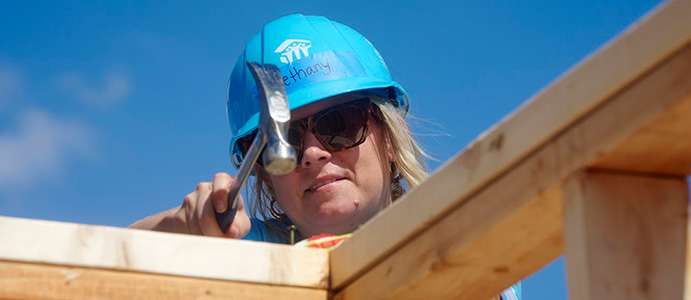 Habitat volunteer working on a house construction project