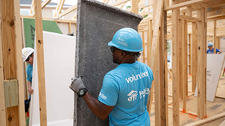 Habitat team member working on a home project