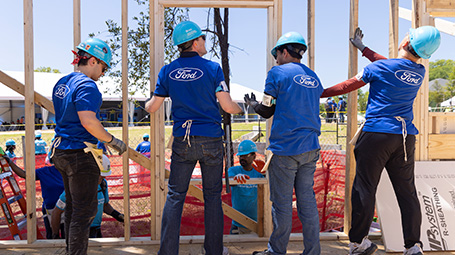 Corporate volunteers working on a Habitat home construction project